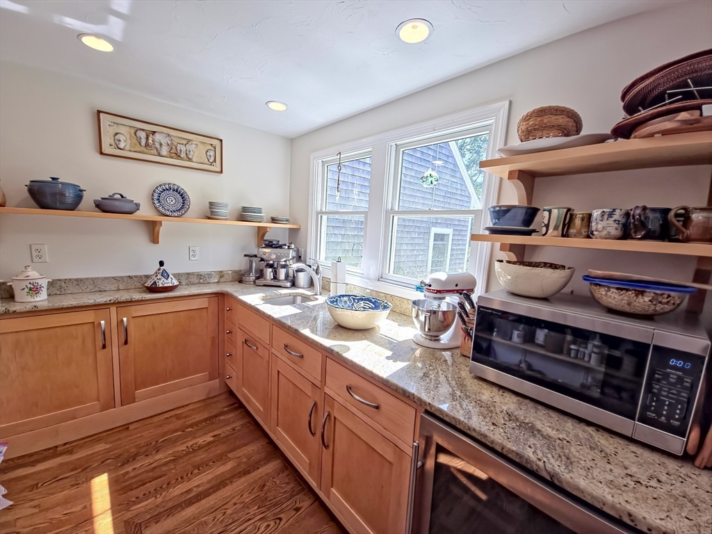 61 Wintergreen Road Mashpee, MA 02649 - Photo 7 of 35 a kitchen with stainless steel appliances a sink and a stove
