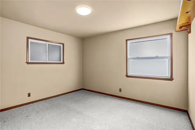 a view of an empty room with walk in closet