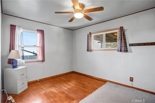 a room with closet and chandelier fan