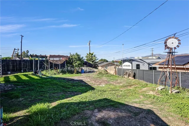 a view of a patio with table and chairs potted plants with wooden floor