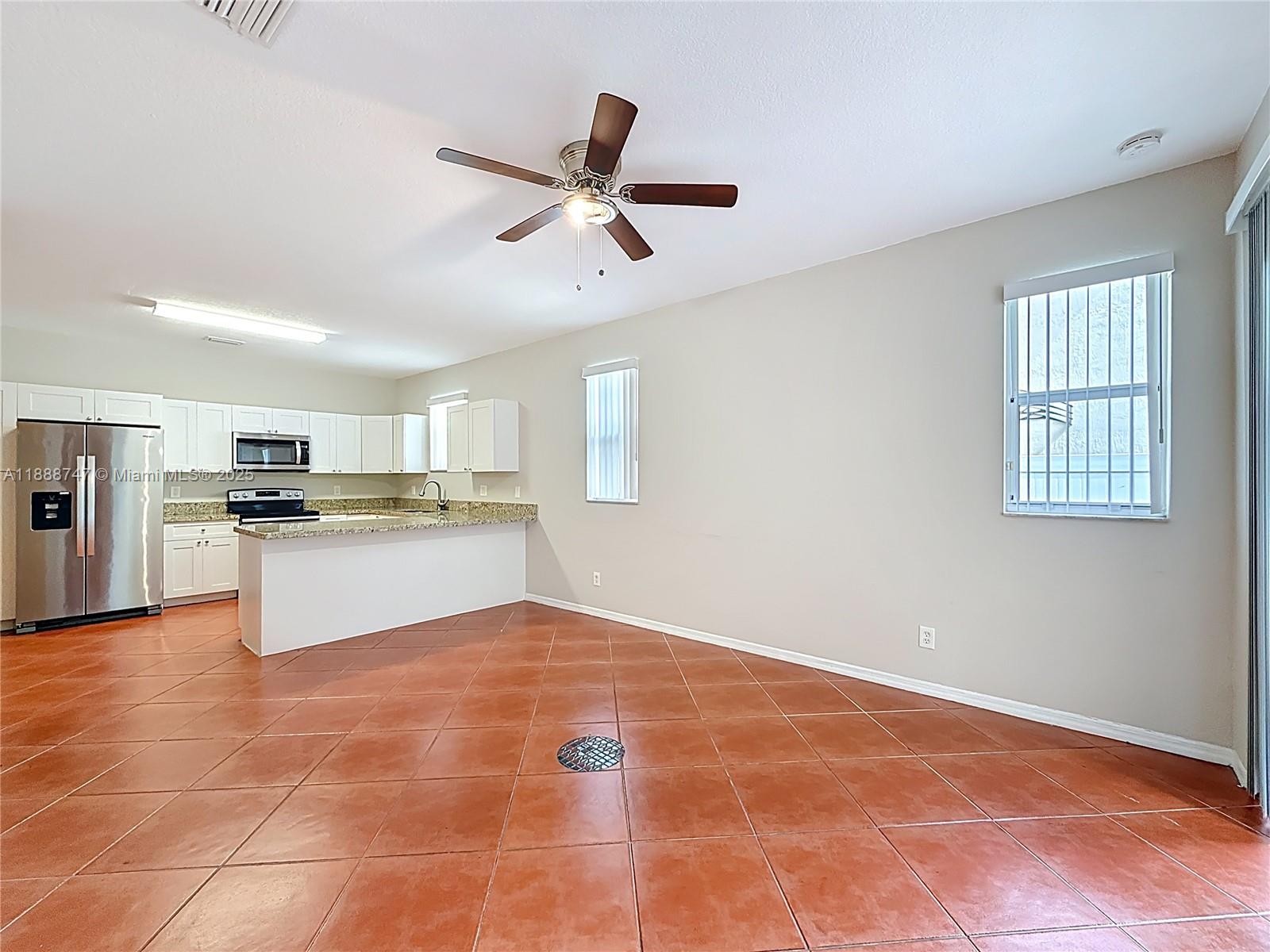 5317 Southwest 133rd Avenue Miramar, FL 33027 - Photo 13 of 38 a view of kitchen with cabinet and refrigerator