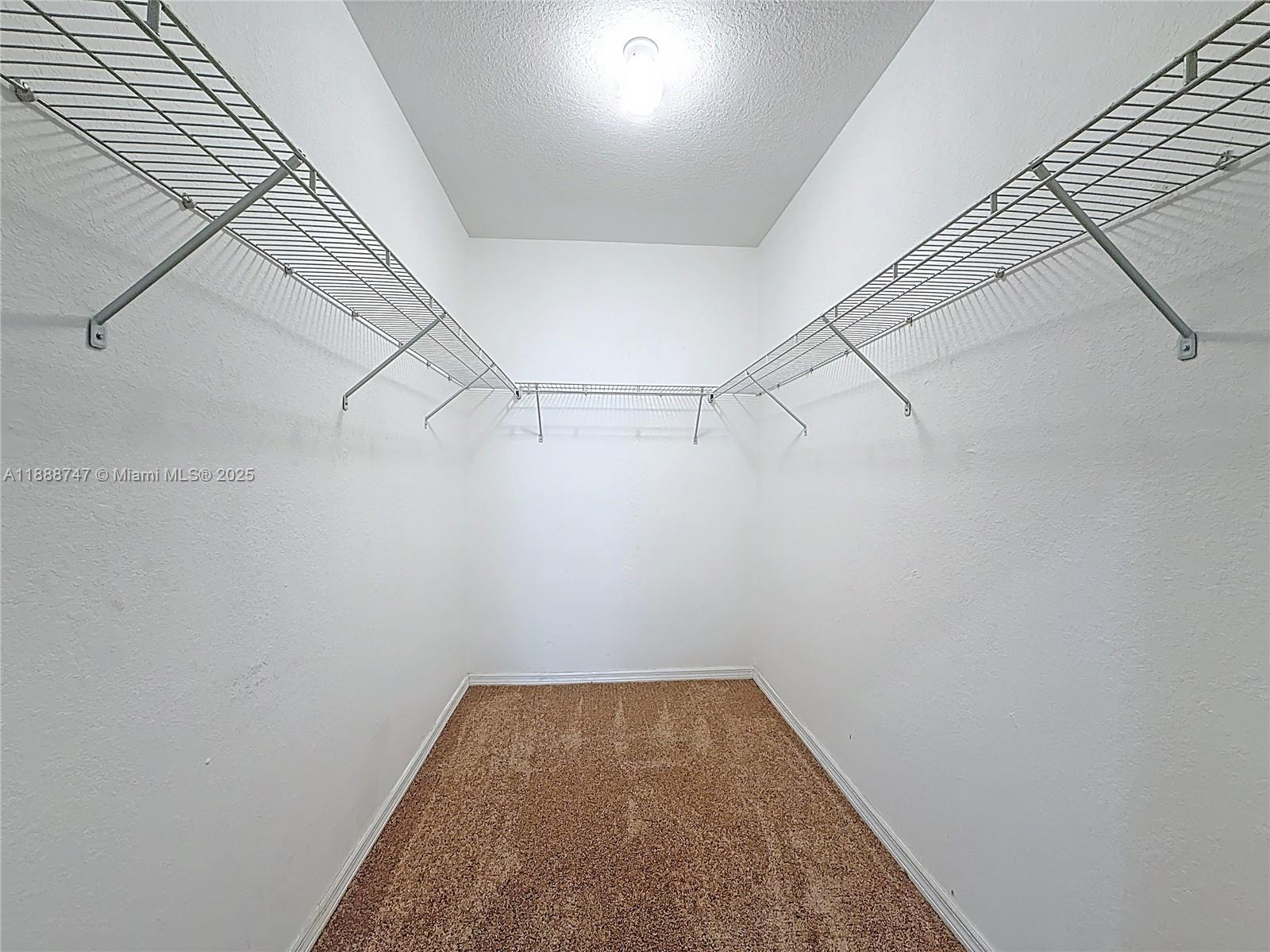 5317 Southwest 133rd Avenue Miramar, FL 33027 - Photo 20 of 38 a view of a room with racks on the wall