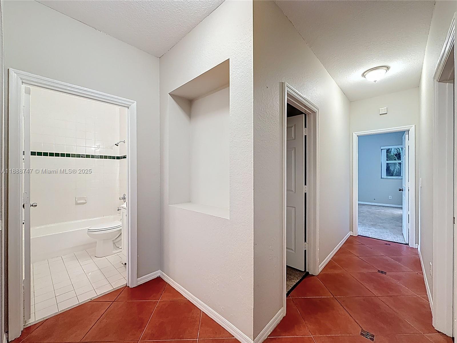 5317 Southwest 133rd Avenue Miramar, FL 33027 - Photo 26 of 38 a view of room with hardwood floor and cabinet