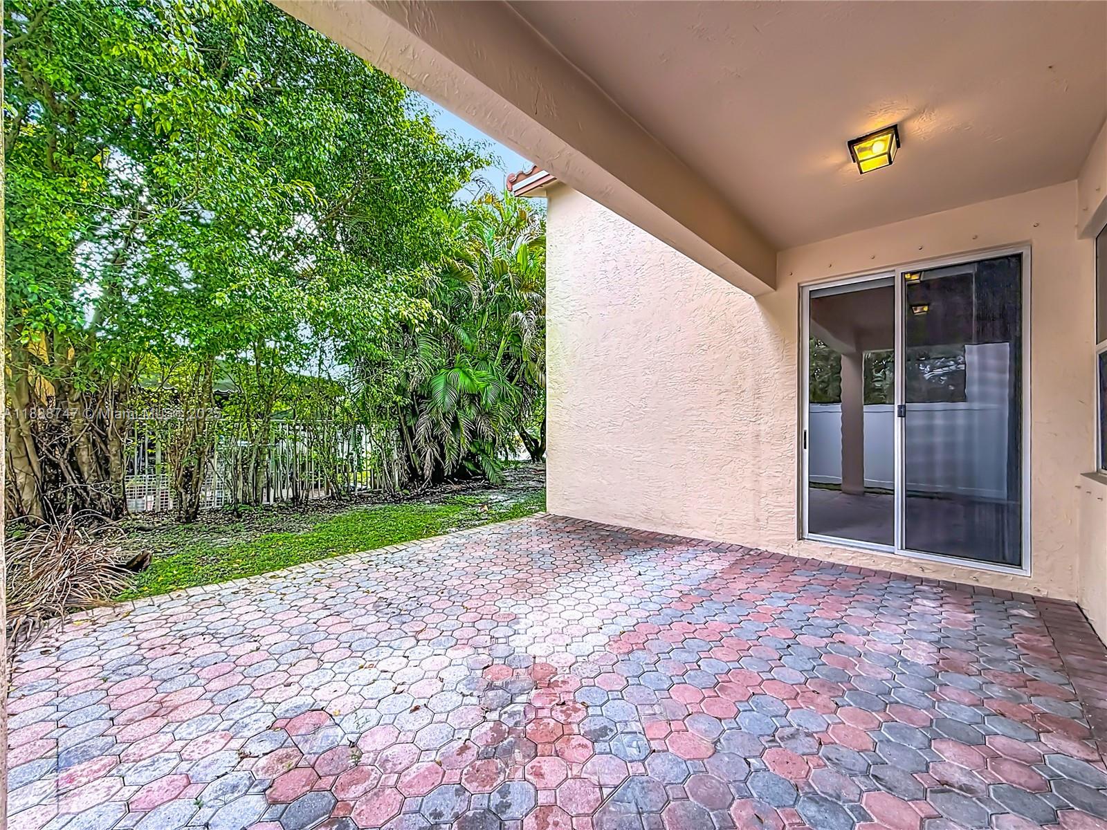 5317 Southwest 133rd Avenue Miramar, FL 33027 - Photo 31 of 38 a view of a back yard with an outdoor space