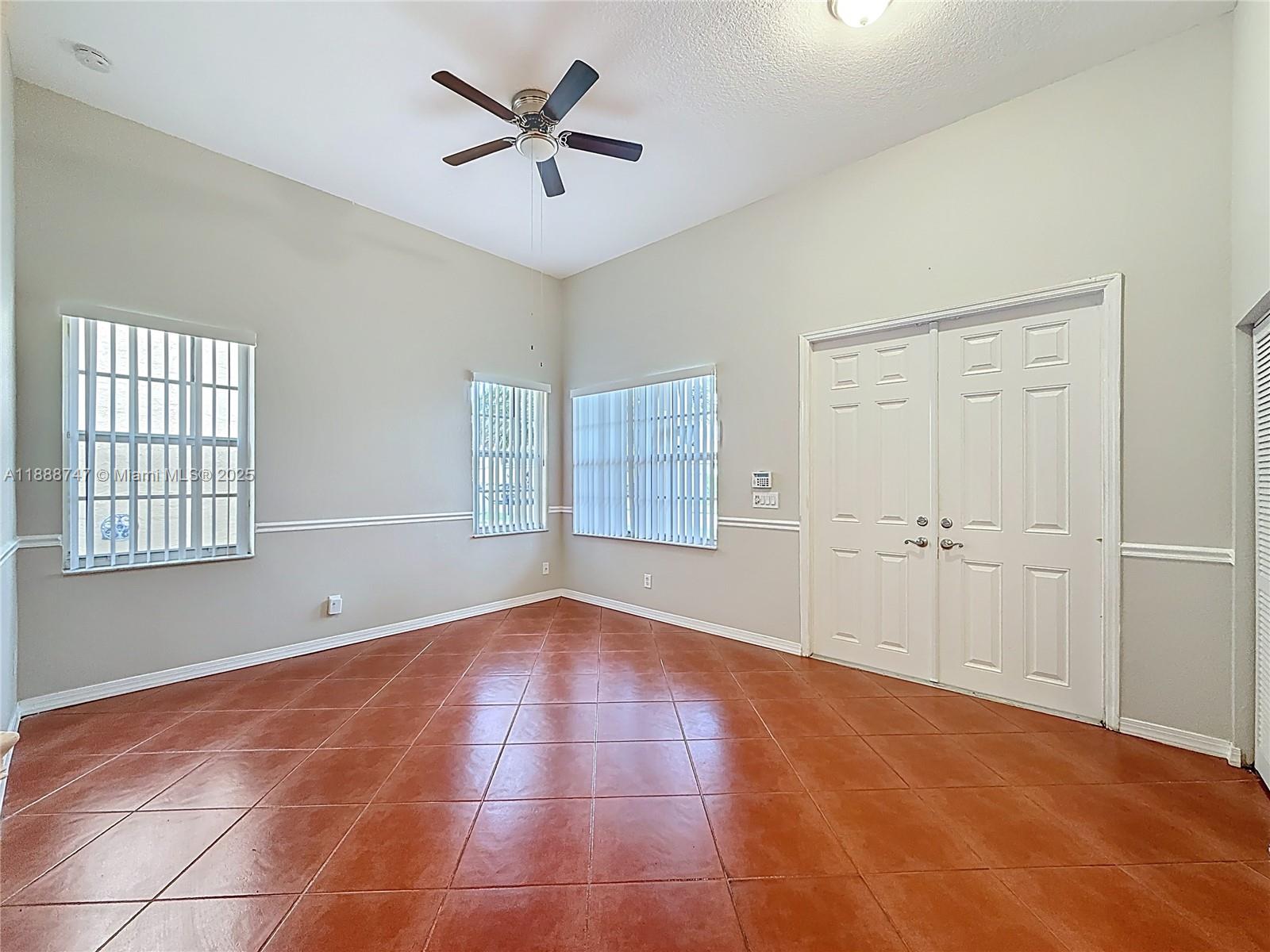 5317 Southwest 133rd Avenue Miramar, FL 33027 - Photo 5 of 38 a view of an empty room with a window