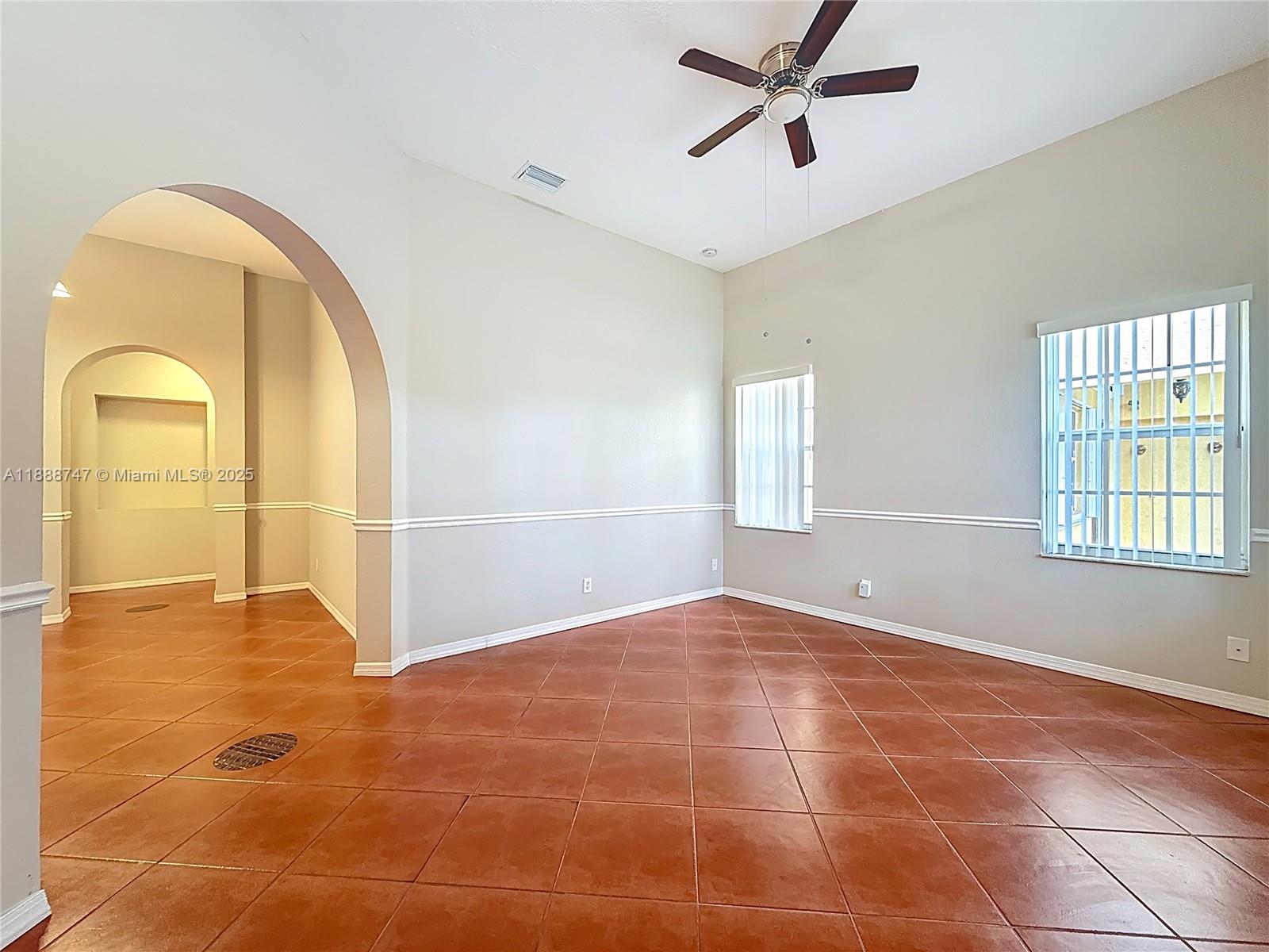 5317 Southwest 133rd Avenue Miramar, FL 33027 - Photo 6 of 38 a view of an empty room with a window
