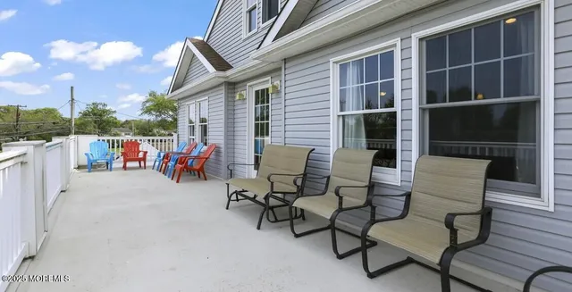 a view of a chairs with a table in balcony