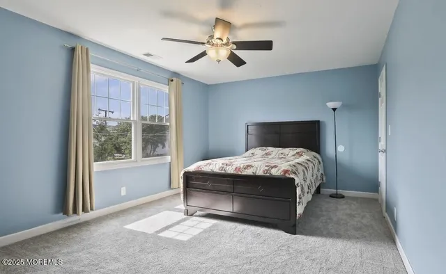 a view of a house with backyard and porch
