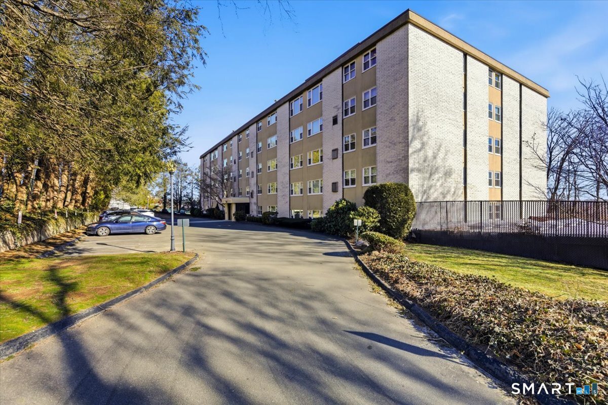 707 East Mix Avenue, Unit 38 Hamden, CT 06514 - Photo 1 of 26 a view of swimming pool with outdoor seating