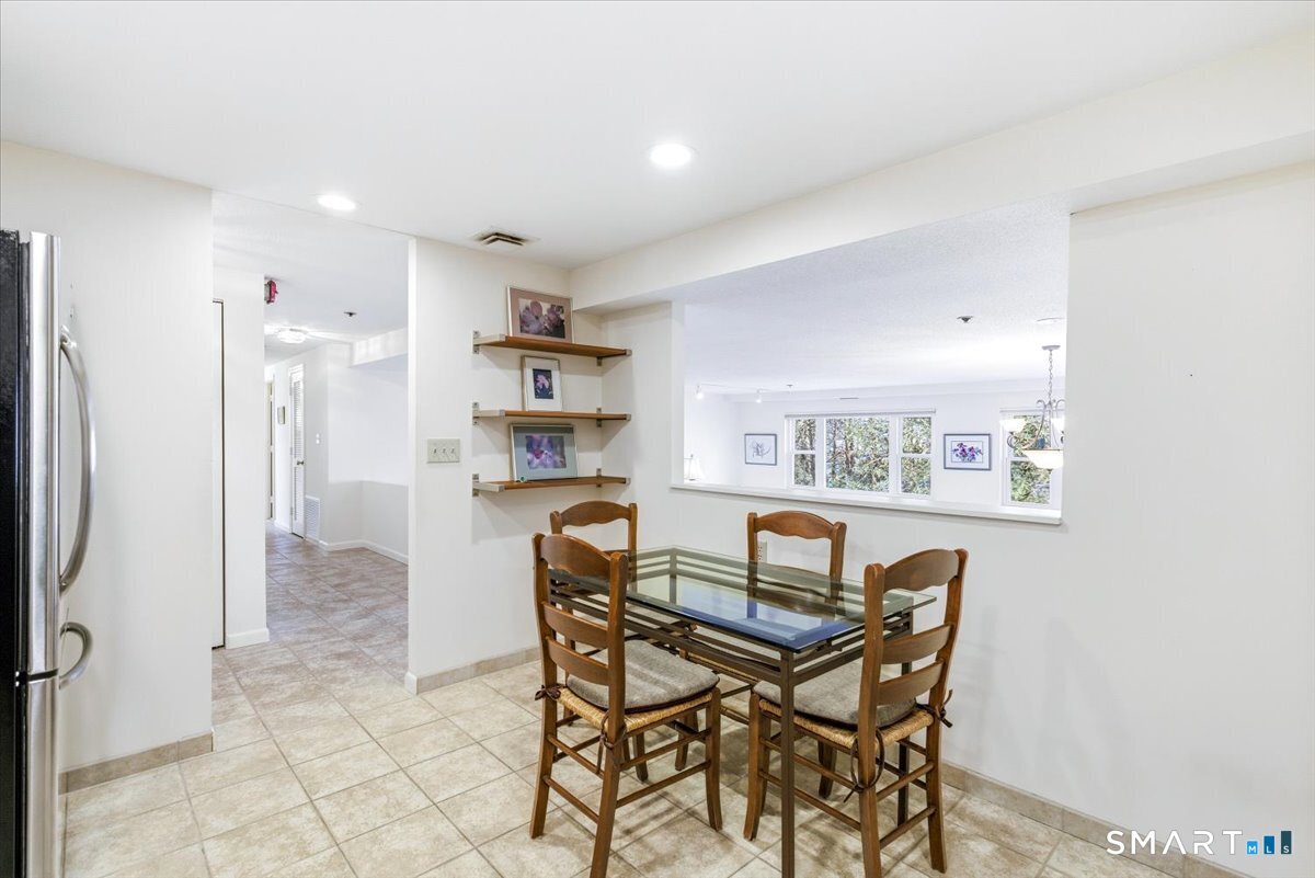 707 East Mix Avenue, Unit 38 Hamden, CT 06514 - Photo 12 of 26 a view of a dining room with furniture