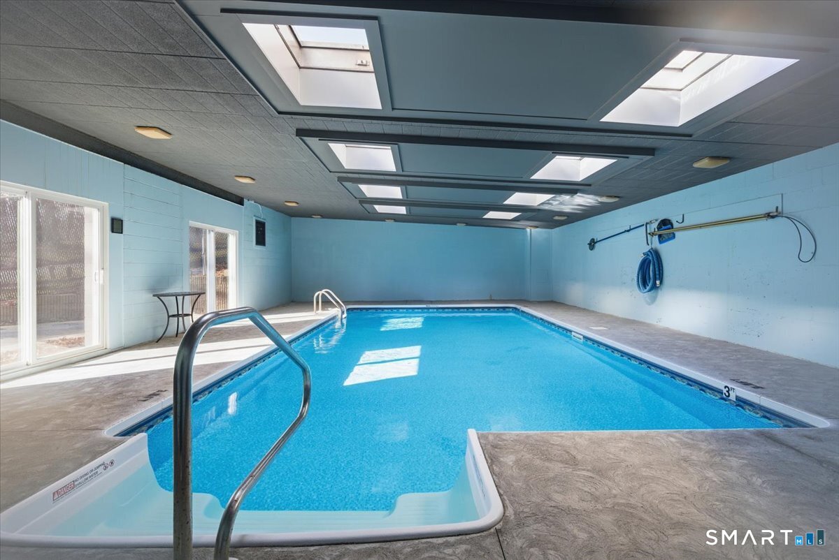707 East Mix Avenue, Unit 38 Hamden, CT 06514 - Photo 23 of 26 a view of a hallway with a couch