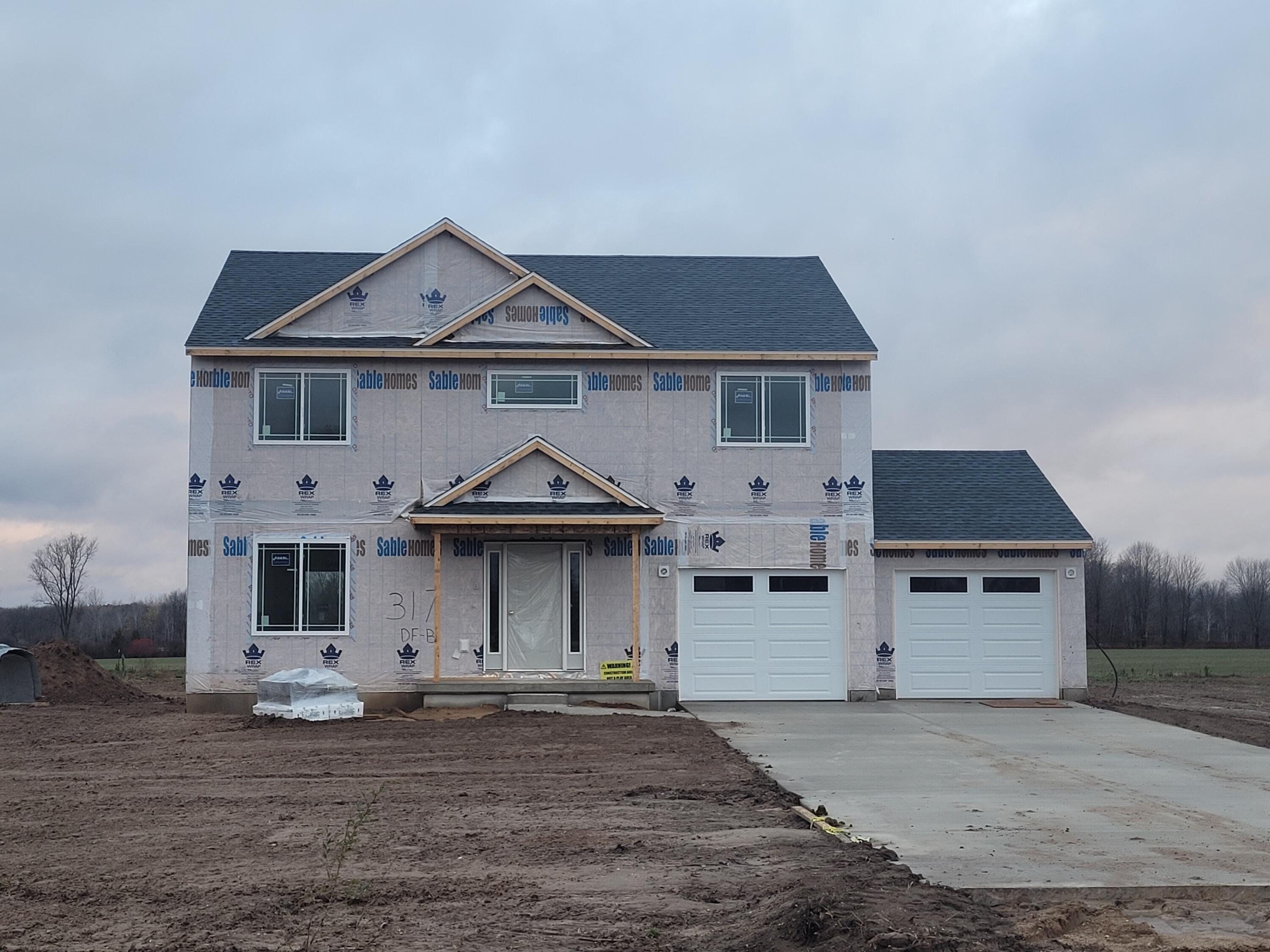 317 Dagget Road Sand Lake, MI 49343 - Photo 1 of 14 front