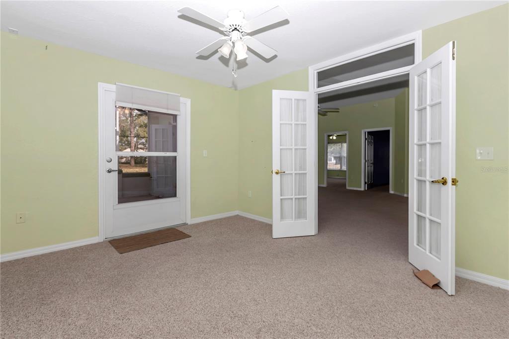 6793 Southwest 111th Loop Ocala, FL 34476 - Photo 32 of 47 Flex room - double French doors entry, office, extra bedroom, craft room, den. Access to screened lanai