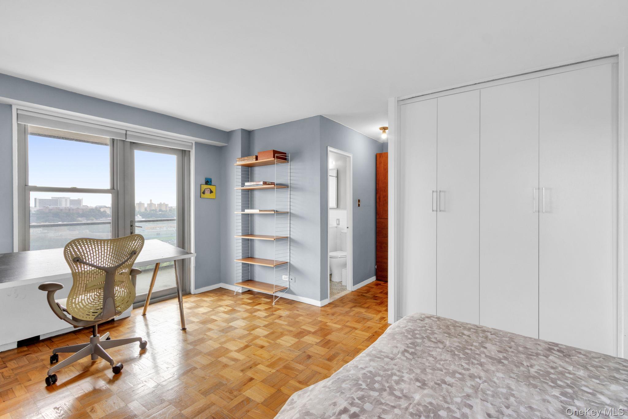 2500 Johnson Avenue, Unit 15P Bronx, NY 10463 - Photo 19 of 50 a view of a workspace with furniture and a window