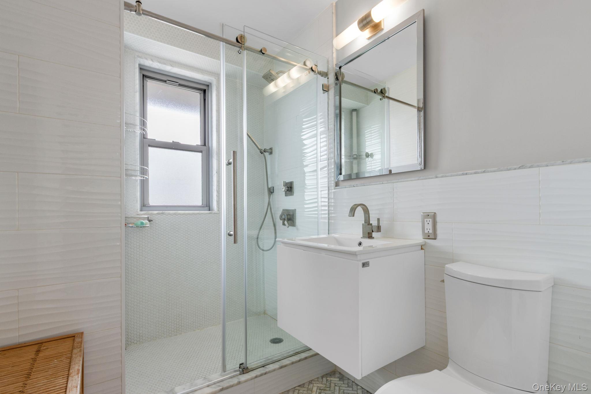 2500 Johnson Avenue, Unit 15P Bronx, NY 10463 - Photo 22 of 50 a bathroom with a sink a toilet and shower