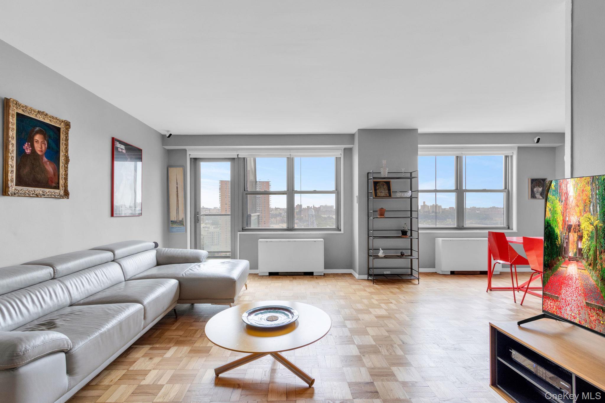 2500 Johnson Avenue, Unit 15P Bronx, NY 10463 - Photo 3 of 50 a living room with furniture and wooden floor