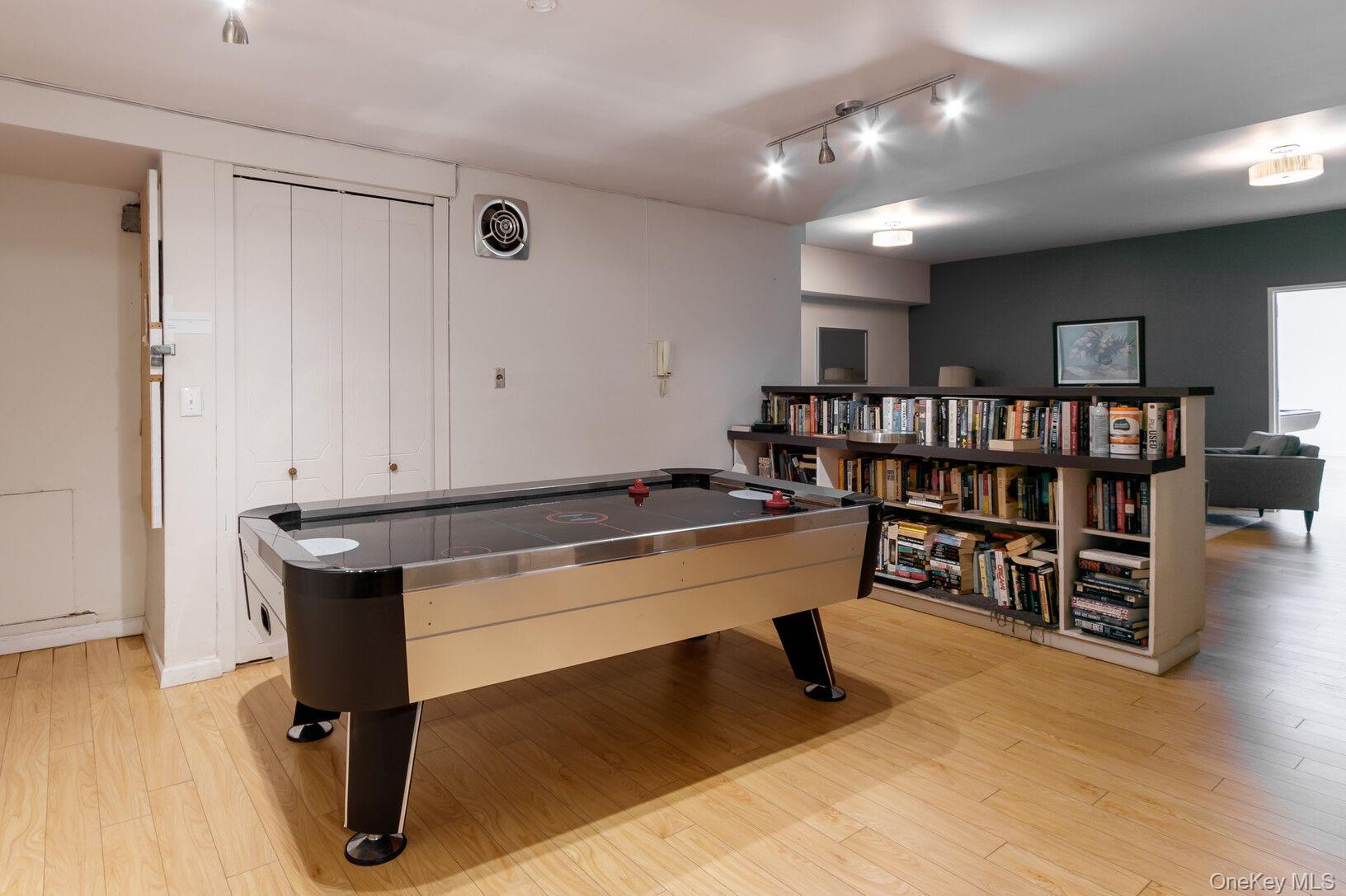 2500 Johnson Avenue, Unit 15P Bronx, NY 10463 - Photo 35 of 50 a room with lots of white furniture and wooden floor