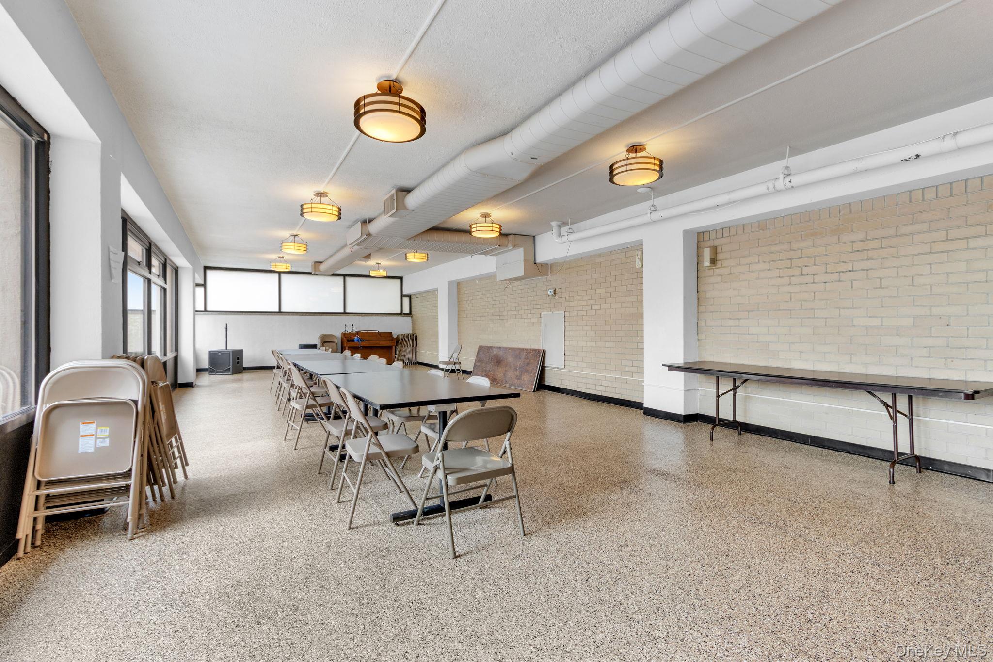 2500 Johnson Avenue, Unit 15P Bronx, NY 10463 - Photo 37 of 50 a dining room with furniture and a window