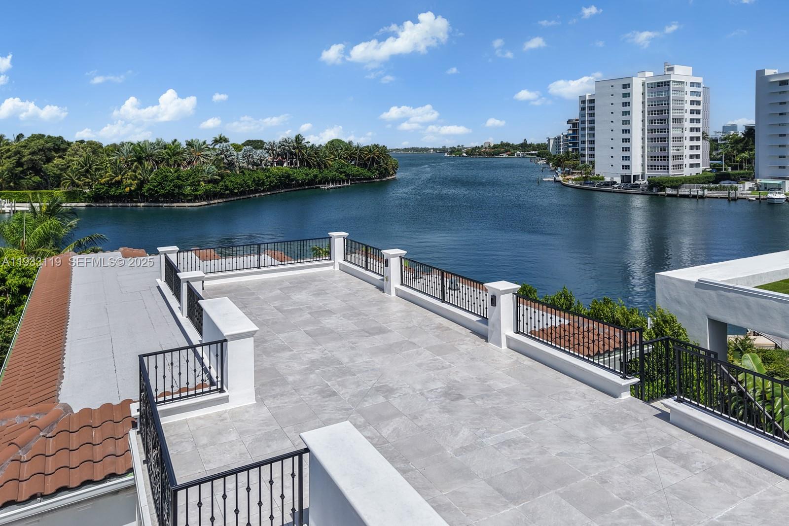 919 92nd Street Surfside, FL 33154 - Photo 12 of 40 a view of a lake with tall buildings