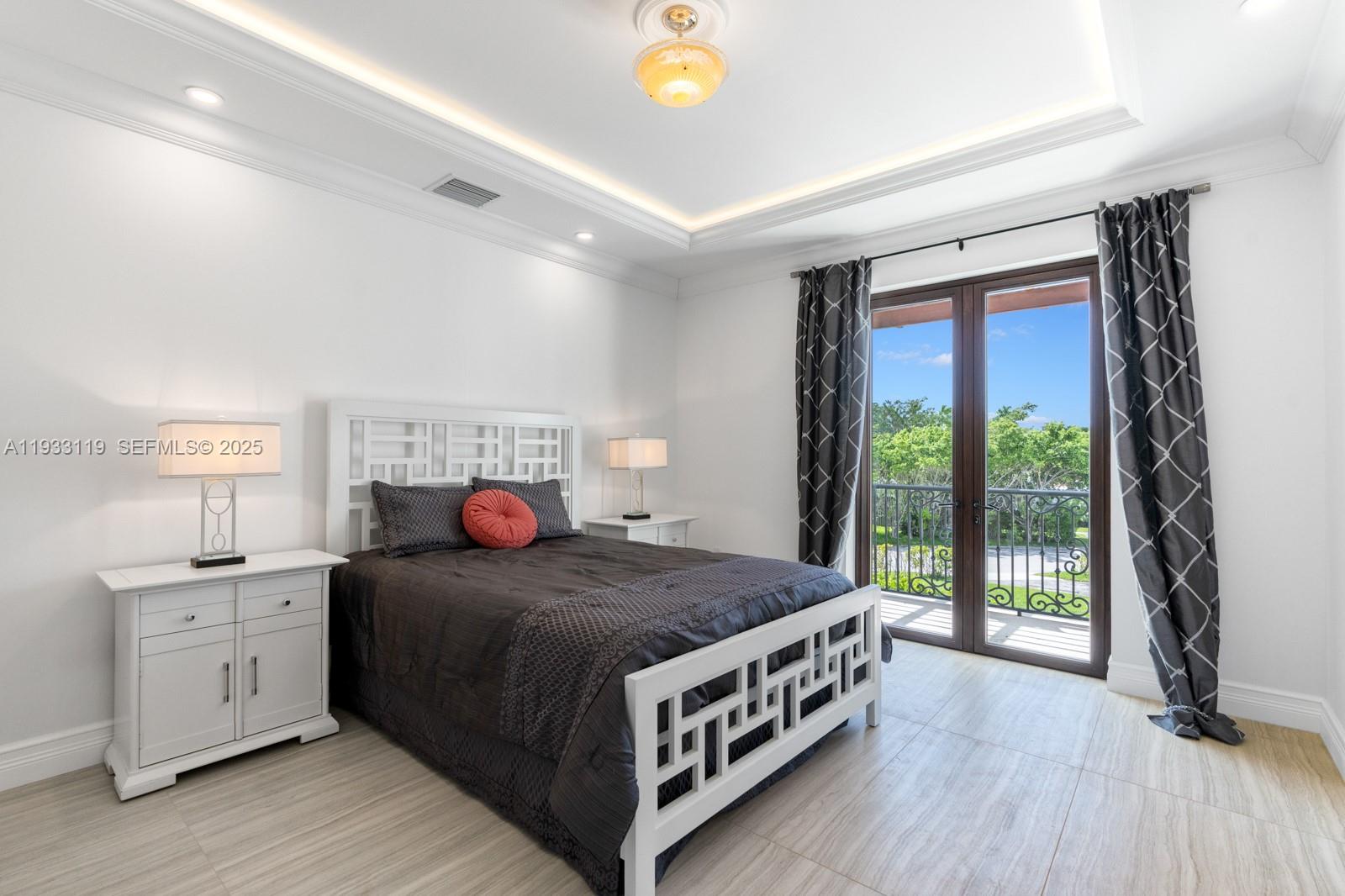 919 92nd Street Surfside, FL 33154 - Photo 35 of 40 a bedroom with a bed and a window