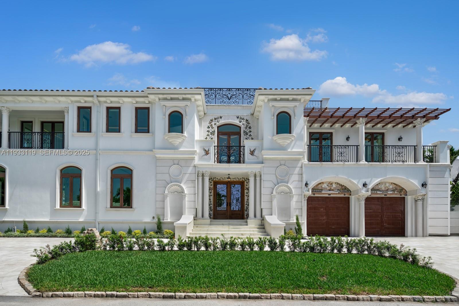919 92nd Street Surfside, FL 33154 - Photo 5 of 40 front view of a house with a yard