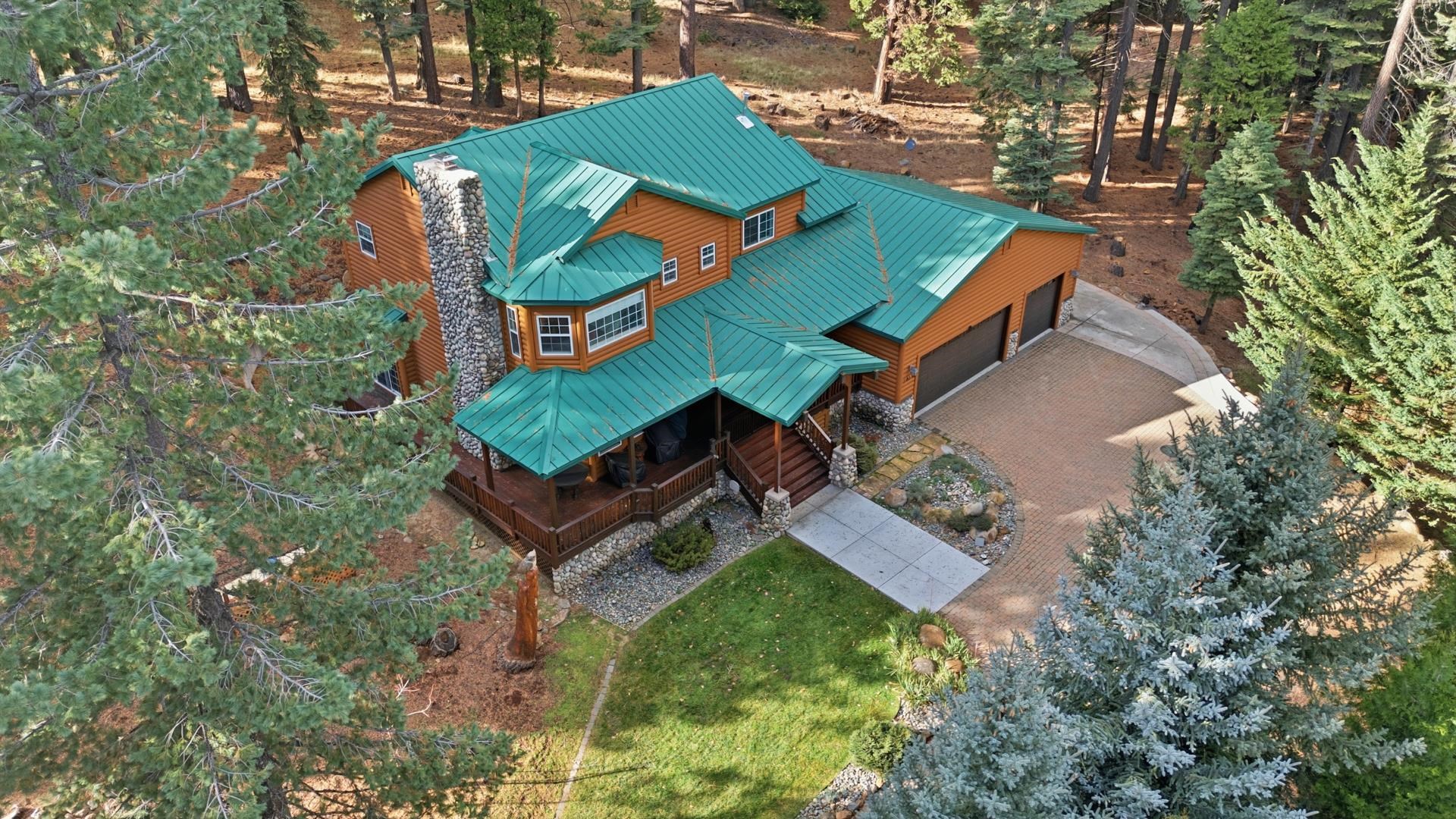 1017 Timber Ridge Road Lake Almanor, CA 96137 - Photo 39 of 45 an aerial view of a house with garden space and street view