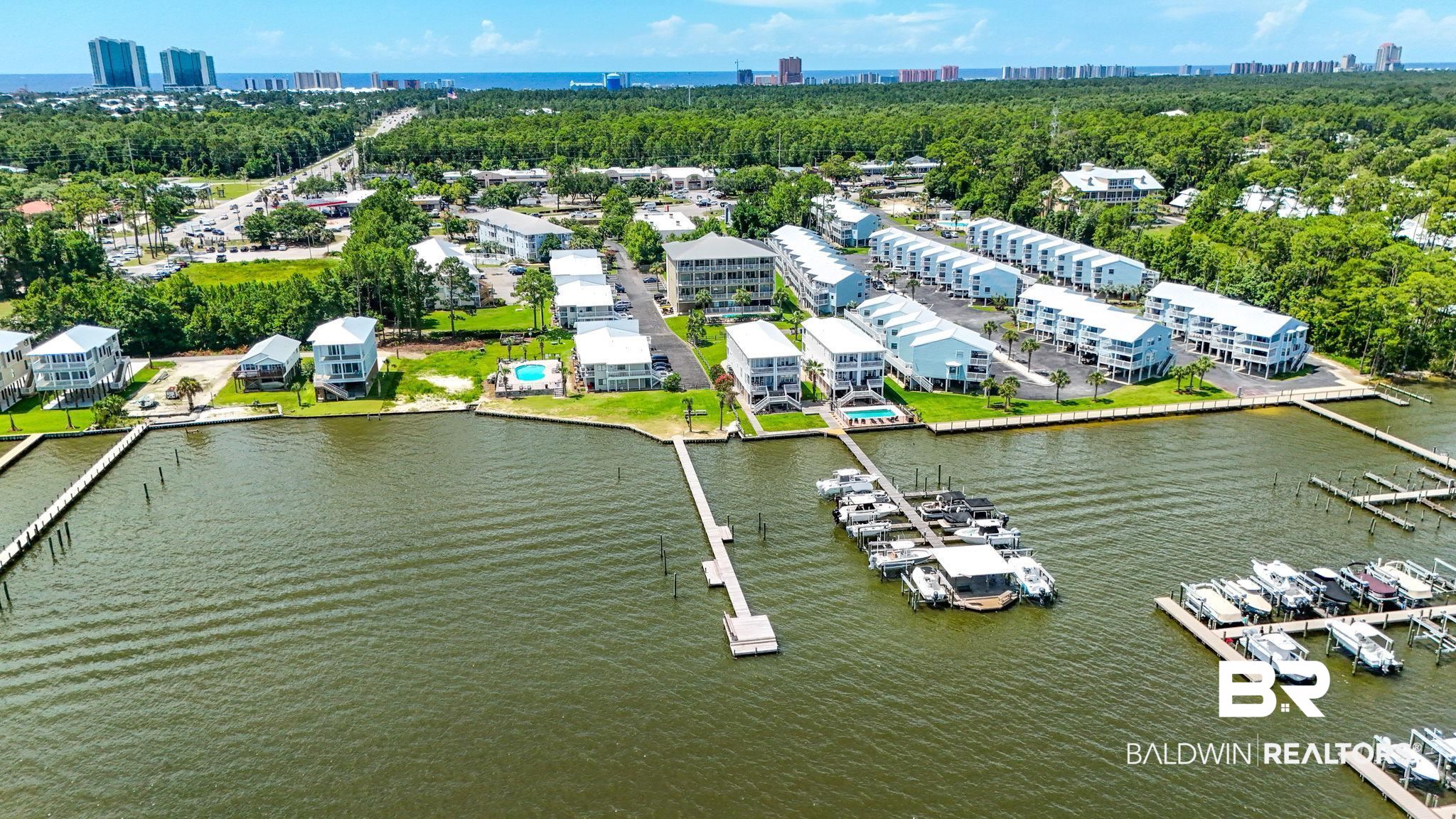 25909 Canal Road, Unit 203 Orange Beach, AL 36561 - Photo 3 of 36 Drone / aerial view of a large body of water and skyline