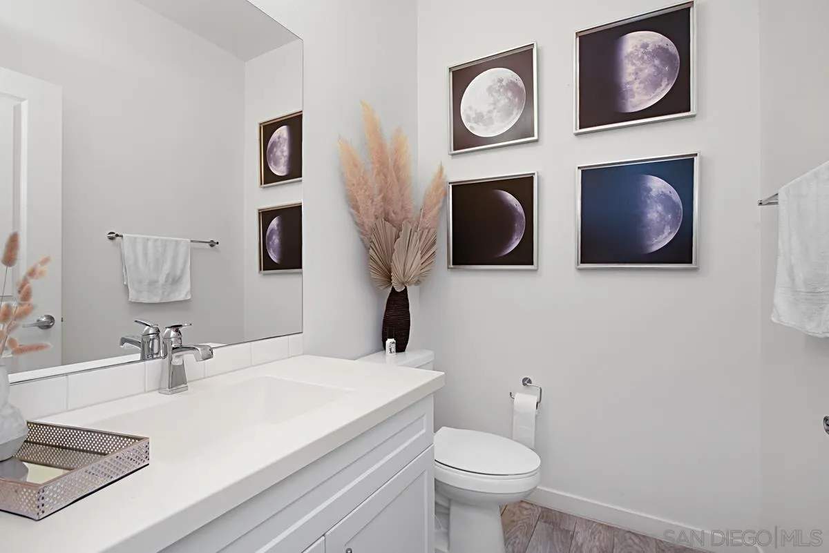 2036 Foxtrot Loop, Unit 4 Chula Vista, CA 91915 - Photo 15 of 33 a bathroom with a toilet sink and mirror
