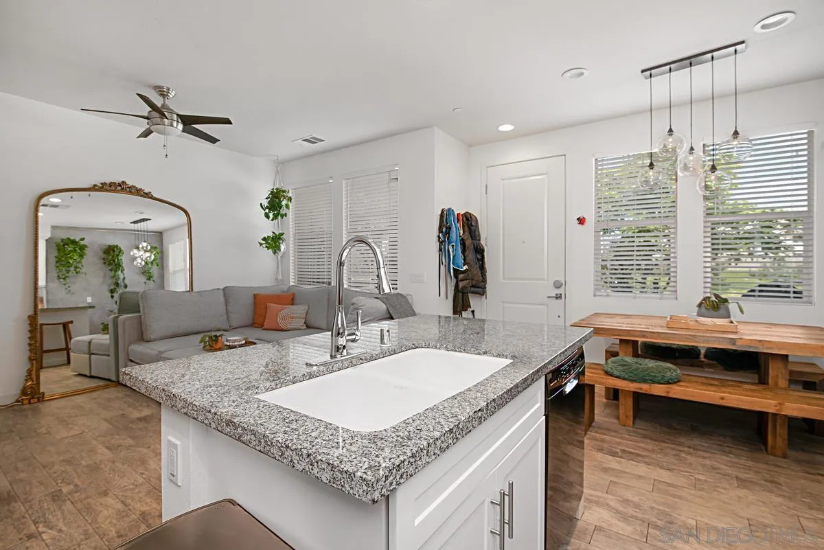 2036 Foxtrot Loop, Unit 4 Chula Vista, CA 91915 - Photo 20 of 33 a bathroom with a granite countertop sink and a mirror