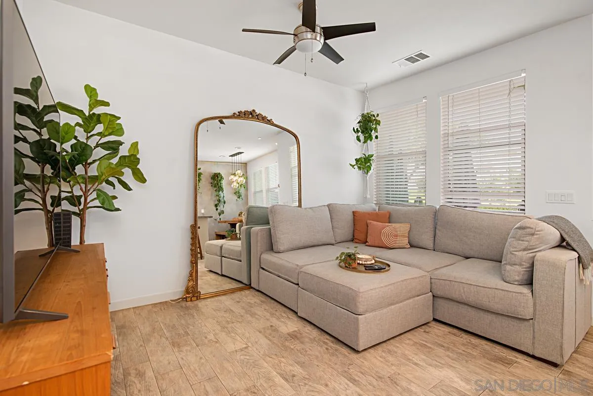 2036 Foxtrot Loop, Unit 4 Chula Vista, CA 91915 - Photo 2 of 33 a living room with furniture and a potted plant