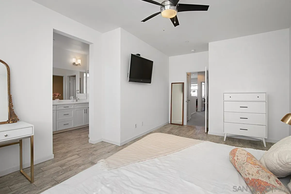 2036 Foxtrot Loop, Unit 4 Chula Vista, CA 91915 - Photo 21 of 33 a bedroom with a bed and a television
