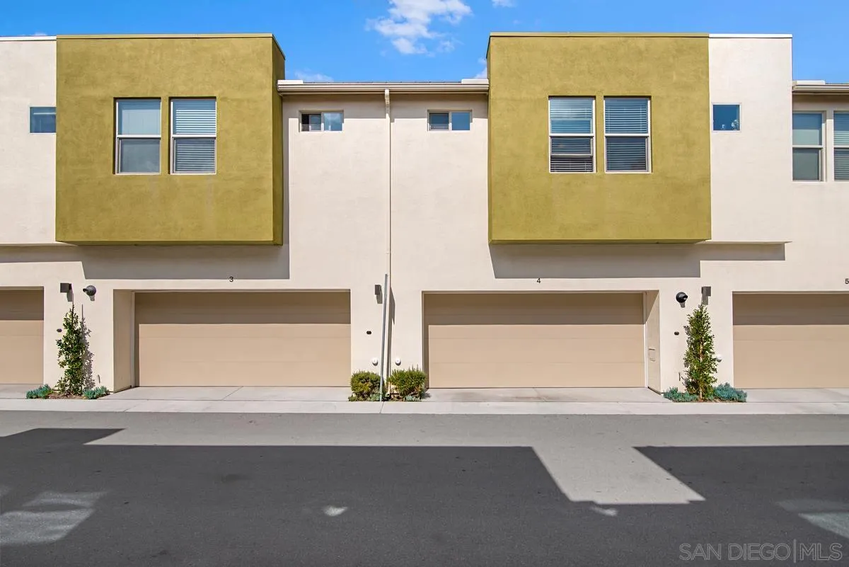 2036 Foxtrot Loop, Unit 4 Chula Vista, CA 91915 - Photo 25 of 33 a view of a brick house with many windows