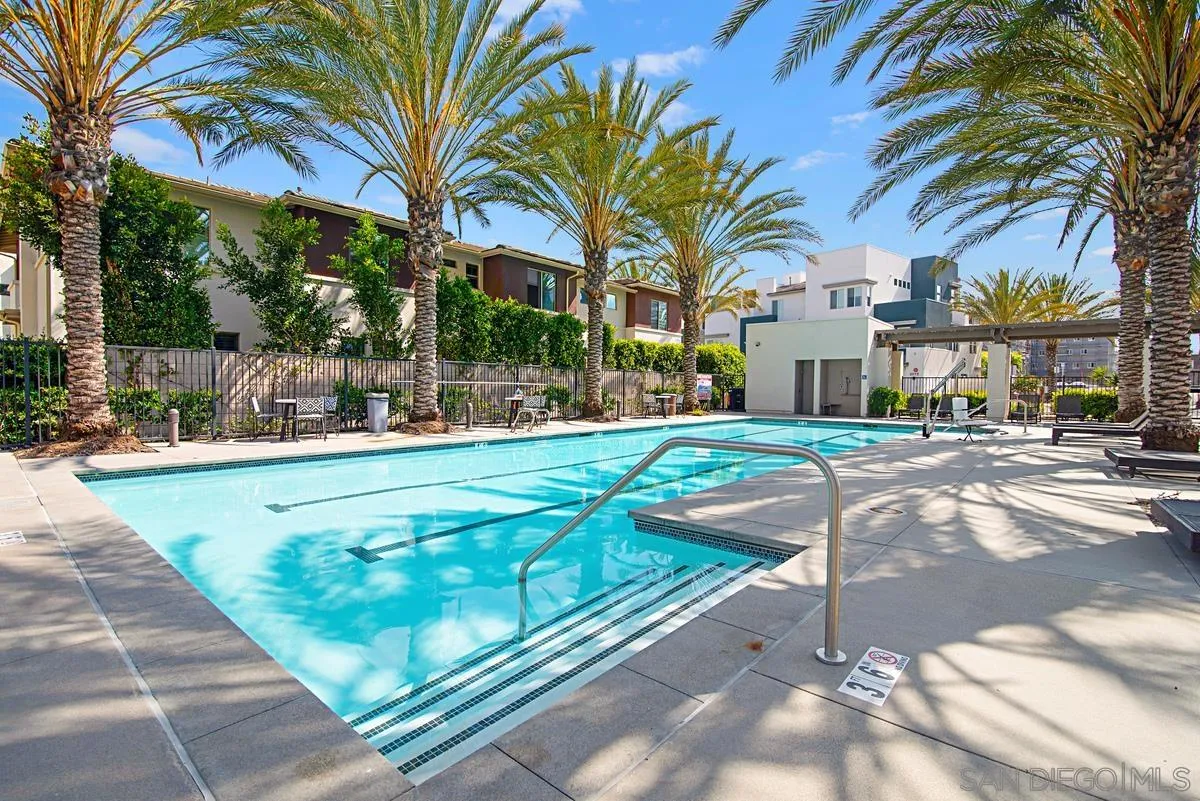 2036 Foxtrot Loop, Unit 4 Chula Vista, CA 91915 - Photo 26 of 33 a view of a white house with a yard