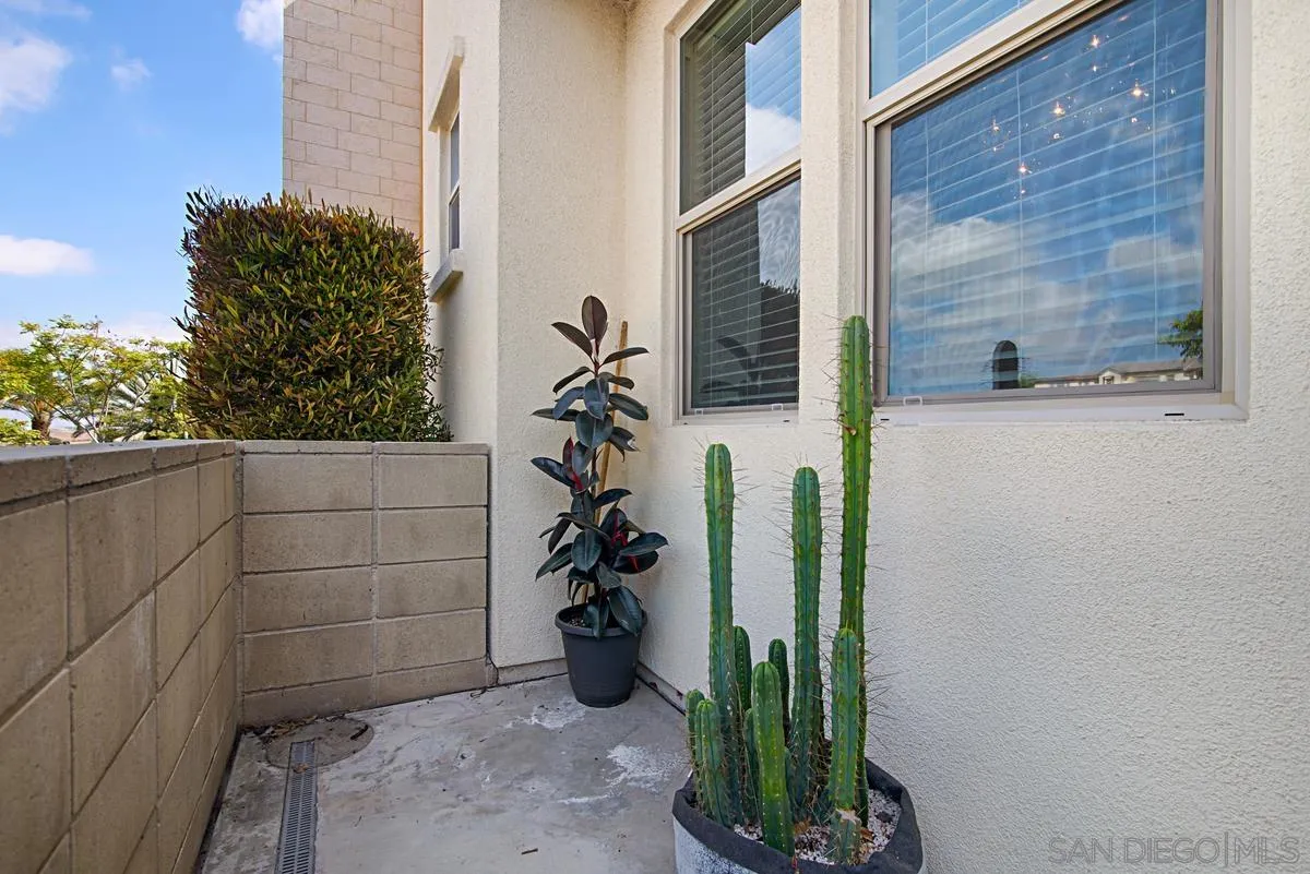 2036 Foxtrot Loop, Unit 4 Chula Vista, CA 91915 - Photo 32 of 33 a view of a potted plants in front of a door