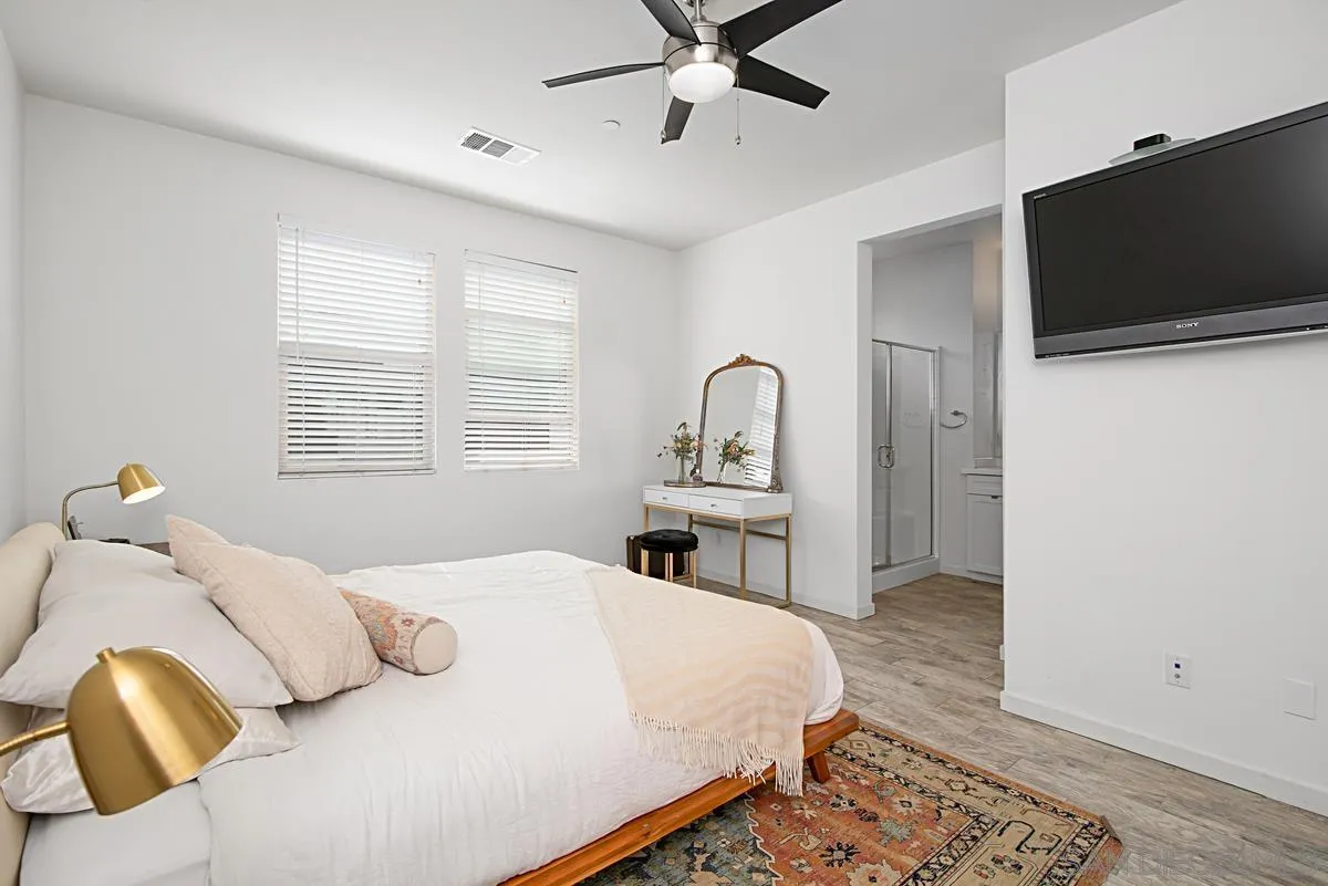 2036 Foxtrot Loop, Unit 4 Chula Vista, CA 91915 - Photo 5 of 33 a bedroom with a bed and a flat screen tv