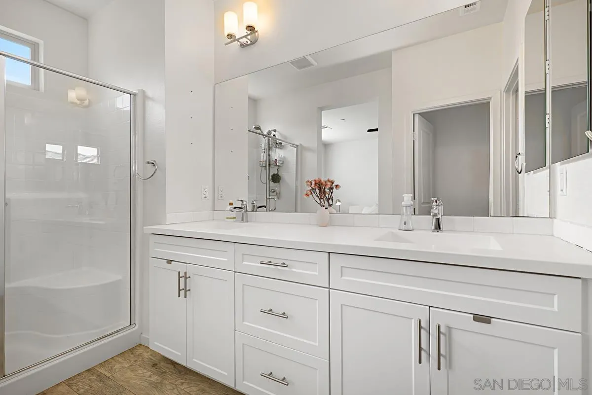 2036 Foxtrot Loop, Unit 4 Chula Vista, CA 91915 - Photo 6 of 33 a bathroom with double sink and a mirror