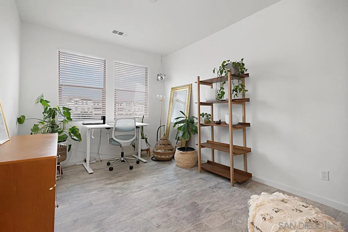 2036 Foxtrot Loop, Unit 4 Chula Vista, CA 91915 - Photo 8 of 33 a view of a workspace with furniture and a window