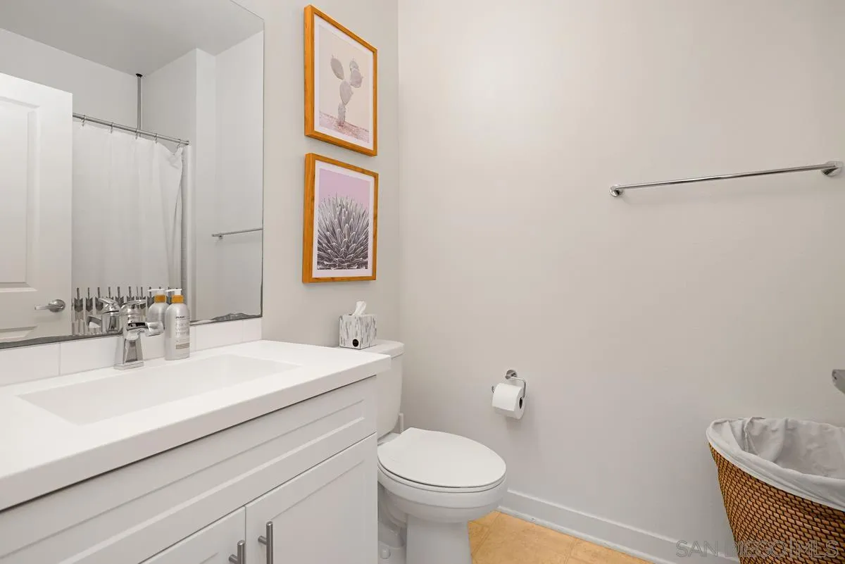 2036 Foxtrot Loop, Unit 4 Chula Vista, CA 91915 - Photo 9 of 33 a bathroom with a sink toilet and a mirror