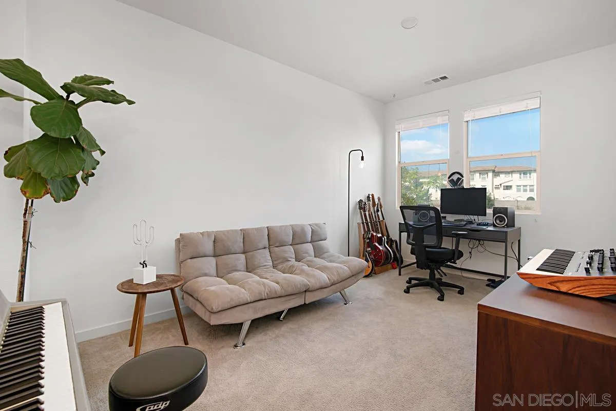 2036 Foxtrot Loop, Unit 4 Chula Vista, CA 91915 - Photo 10 of 33 a living room with furniture a couch and a potted plant
