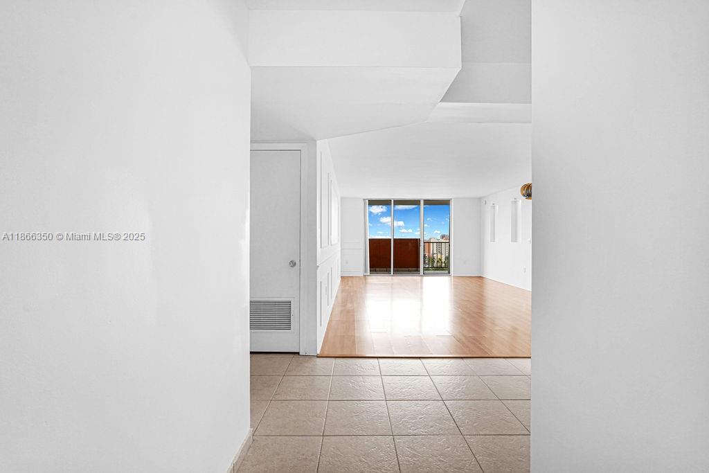 2780 Northeast 183rd Street, Unit 1511 Aventura, FL 33160 - Photo 16 of 29 a view of kitchen with a sink and a refrigerator