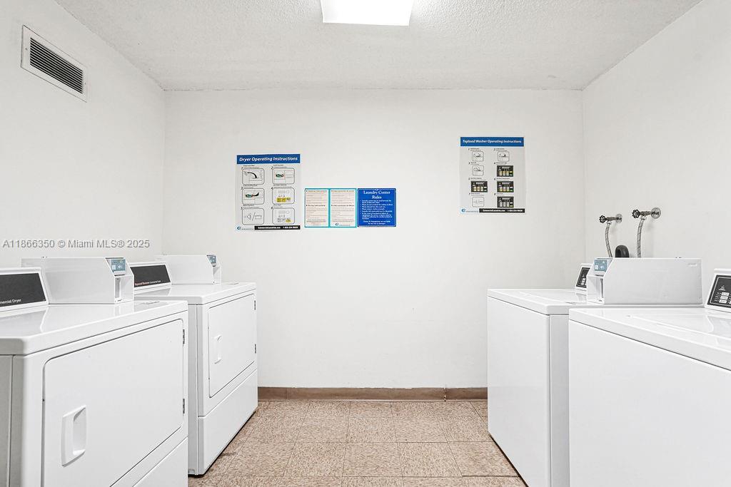 2780 Northeast 183rd Street, Unit 1511 Aventura, FL 33160 - Photo 20 of 29 a utility room with dryer and washer