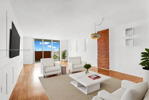 a living room with furniture and a rug