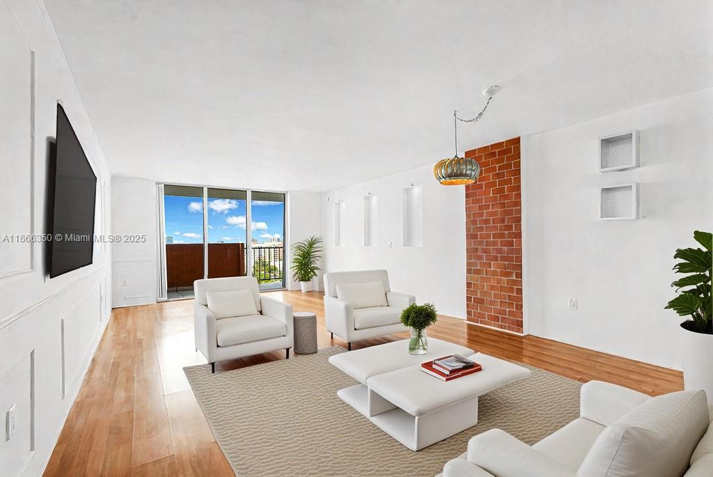 2780 Northeast 183rd Street, Unit 1511 Aventura, FL 33160 - Photo 2 of 29 a living room with furniture and a rug