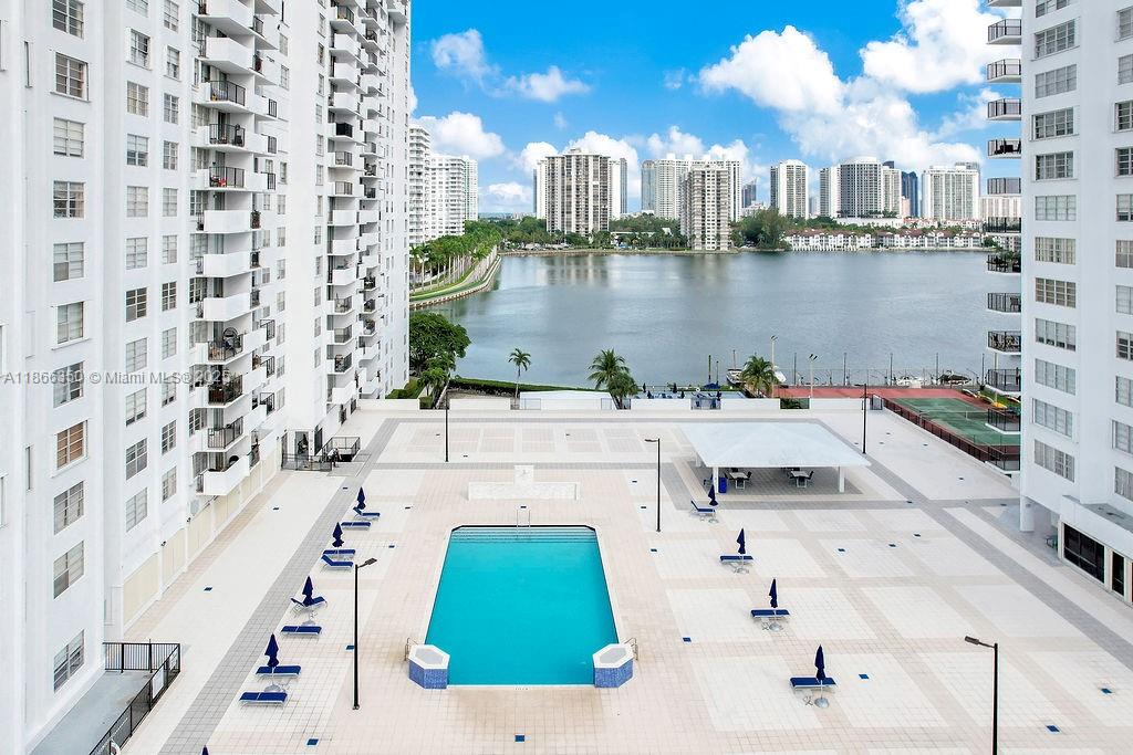 2780 Northeast 183rd Street, Unit 1511 Aventura, FL 33160 - Photo 21 of 29 a terrace with a table and chairs
