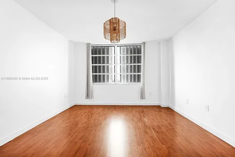 a view of a livingroom with wooden floor