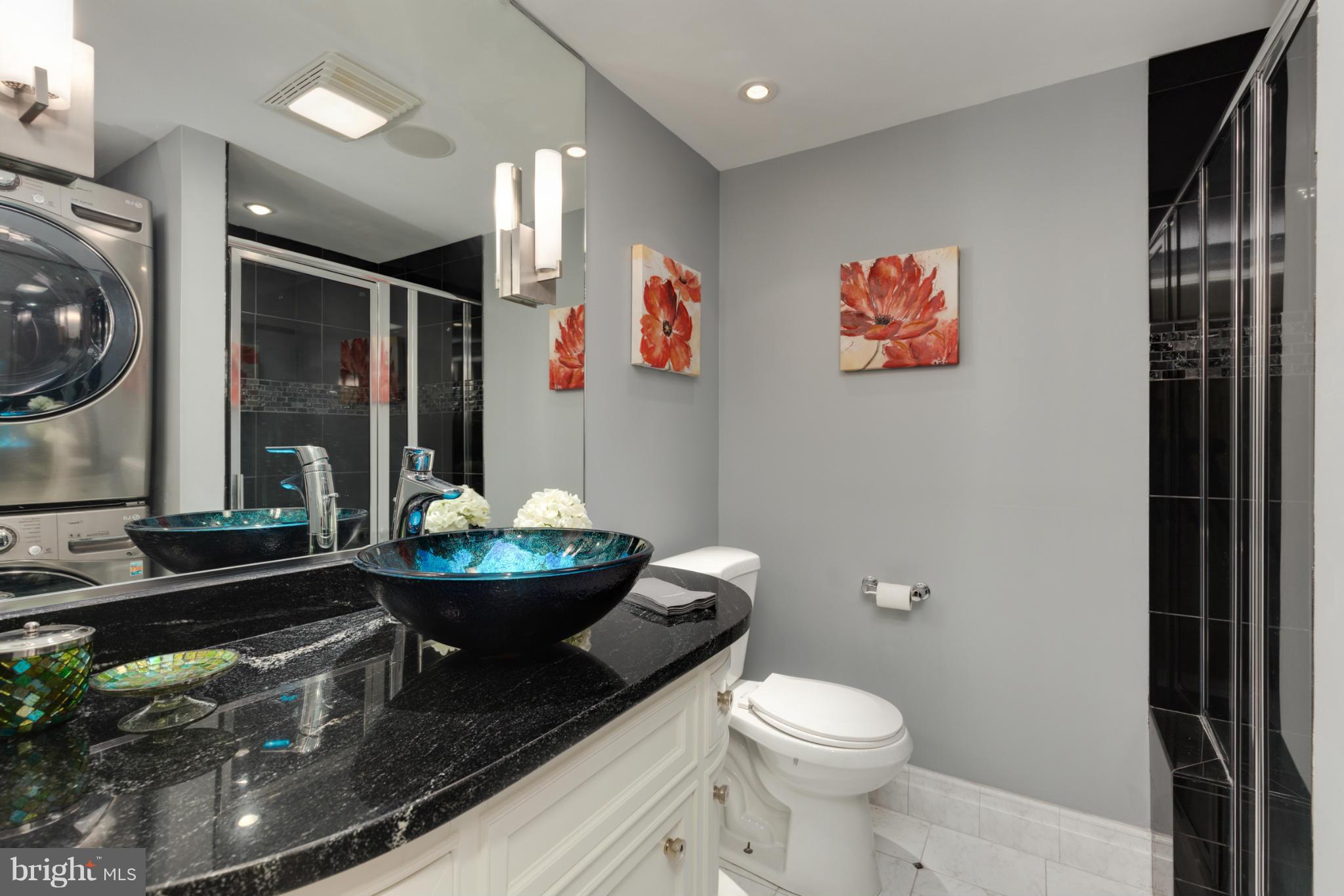 3035 Q Street Northwest, Unit 1 Washington, DC 20007 - Photo 13 of 19 a bathroom with a toilet sink and mirror