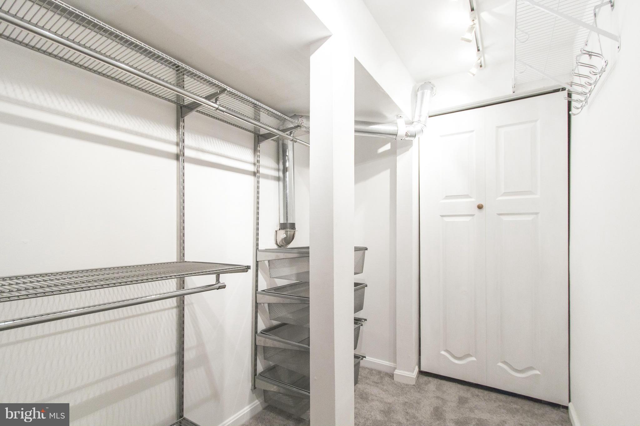 3035 Q Street Northwest, Unit 1 Washington, DC 20007 - Photo 16 of 19 a bathroom with a shower and a glass door