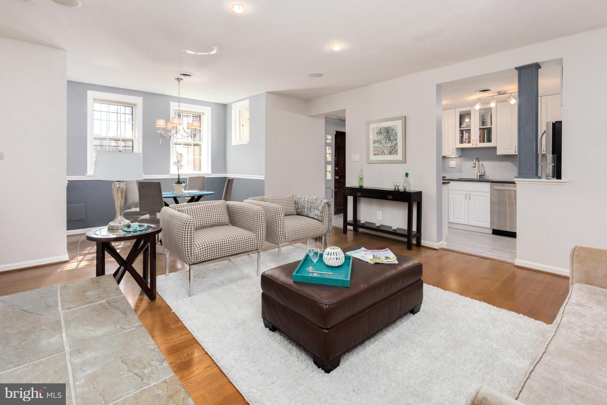 3035 Q Street Northwest, Unit 1 Washington, DC 20007 - Photo 5 of 19 a living room with furniture and wooden floor