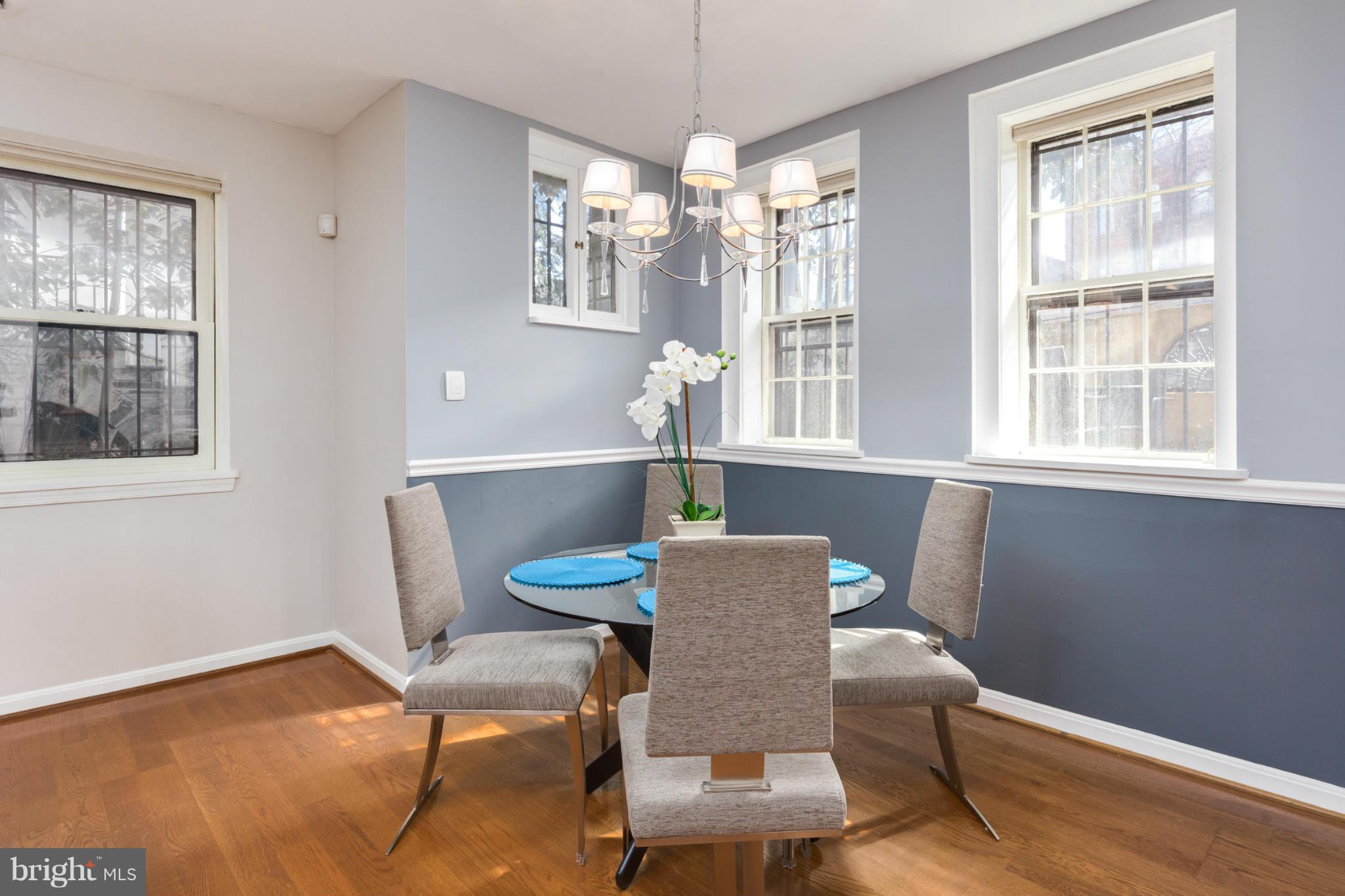 3035 Q Street Northwest, Unit 1 Washington, DC 20007 - Photo 6 of 19 a view of a dining room with furniture window and wooden floor