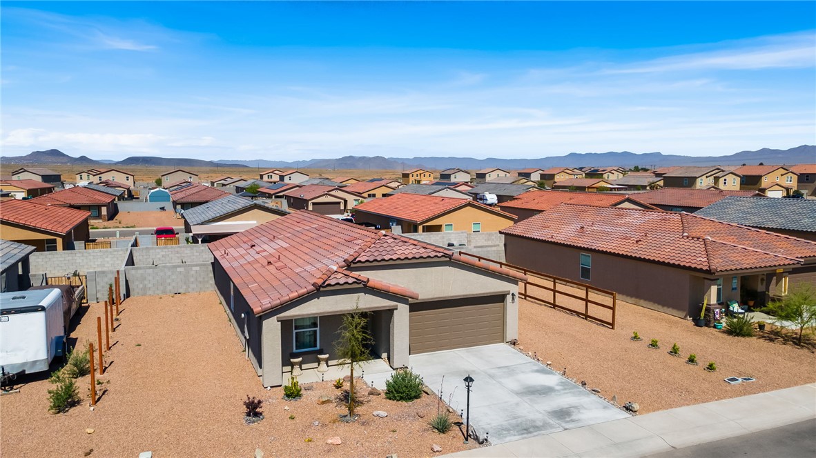 3623 East Andrea Drive Kingman, AZ 86409 - Photo 29 of 40 This property features a stucco exterior with a tile roof and an attached garage
